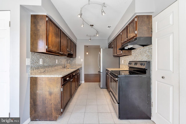 kitchen featuring stainless steel electric range, dark brown cabinets, backsplash, light tile patterned floors, and sink