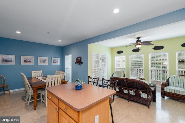 kitchen with ceiling fan and a center island