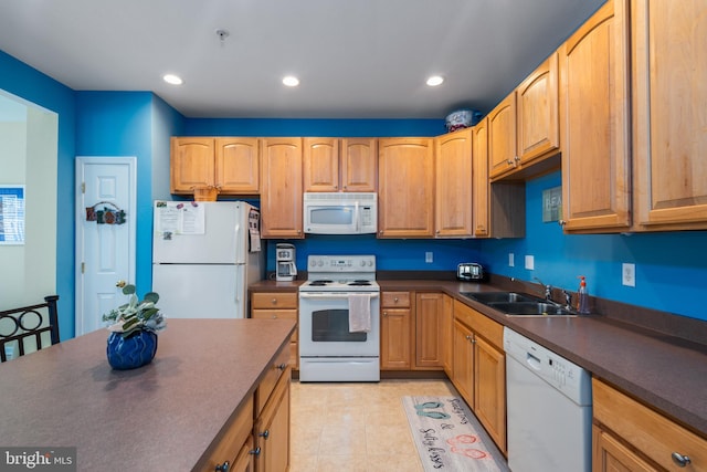 kitchen with white appliances, light tile patterned floors, and sink