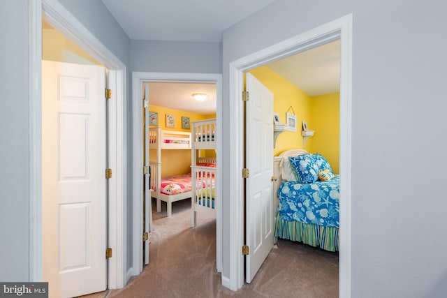 hallway with carpet floors