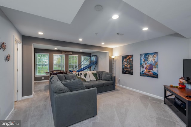 living room featuring light carpet