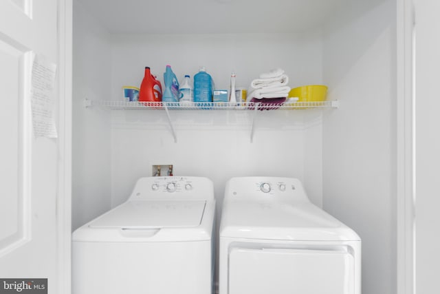 laundry room featuring washing machine and dryer