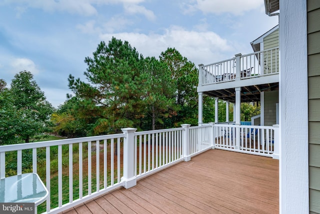 deck featuring a lawn