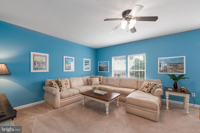 living room with ceiling fan and light colored carpet