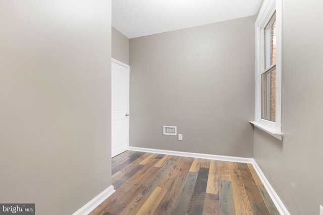 spare room featuring dark hardwood / wood-style floors