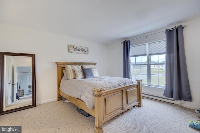 carpeted bedroom with a baseboard radiator