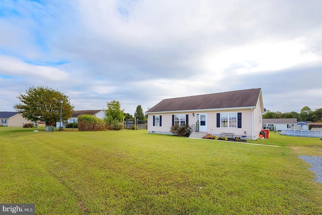 ranch-style home with a front lawn