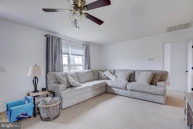 living room featuring carpet and ceiling fan