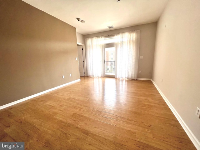 empty room featuring hardwood / wood-style floors