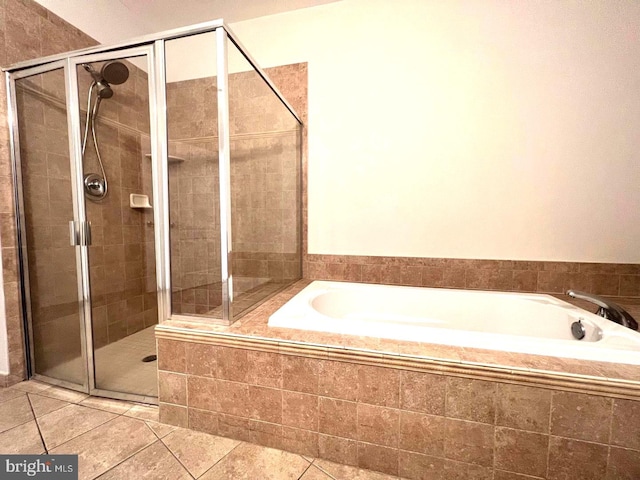 bathroom featuring separate shower and tub and tile patterned flooring