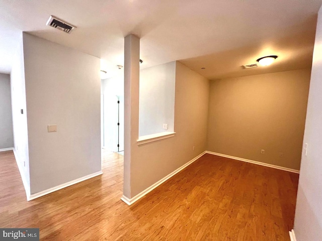 spare room with wood-type flooring