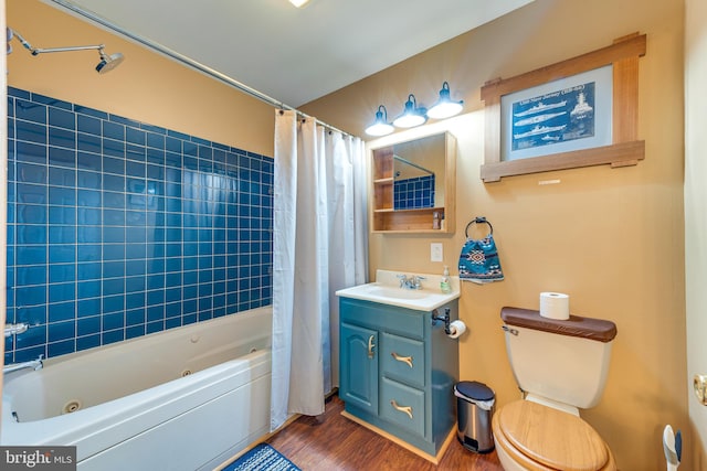 full bathroom featuring shower / bath combination with curtain, vanity, hardwood / wood-style floors, and toilet