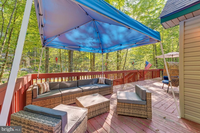 wooden deck featuring outdoor lounge area