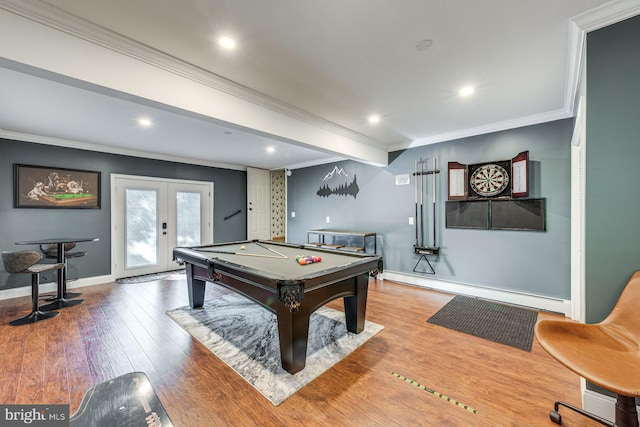 game room with pool table, crown molding, a baseboard heating unit, and hardwood / wood-style flooring