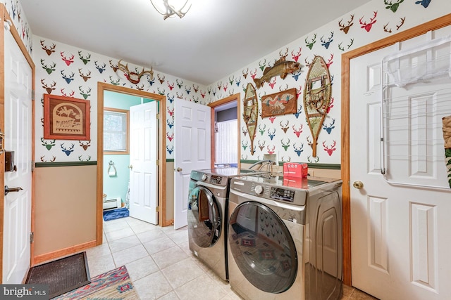 laundry area featuring light tile patterned floors, baseboard heating, and independent washer and dryer