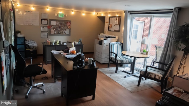 home office featuring wood-type flooring and a wealth of natural light