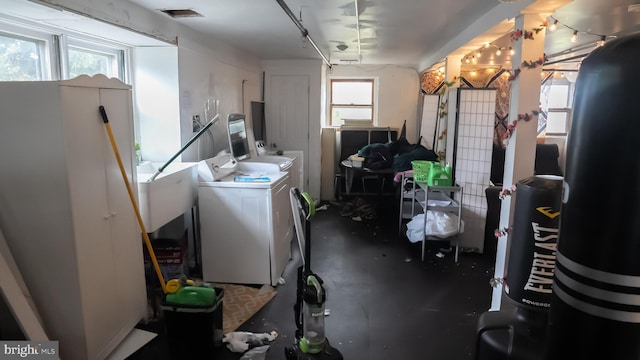 basement featuring washing machine and clothes dryer