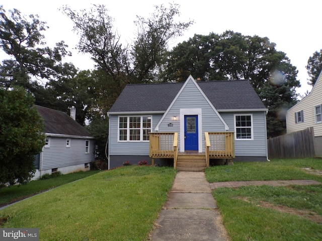 bungalow-style home featuring a front lawn