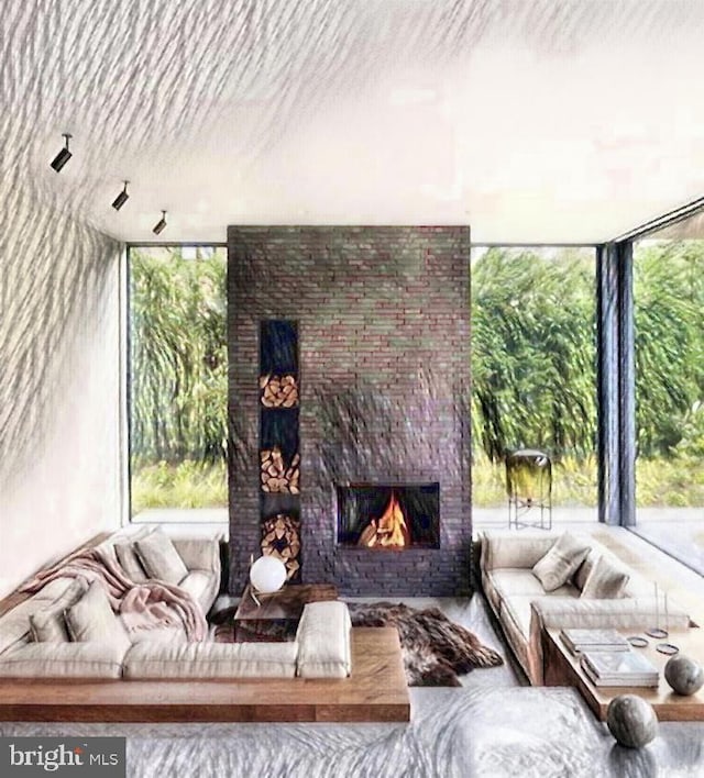 living room with a wealth of natural light, a wall of windows, and a fireplace