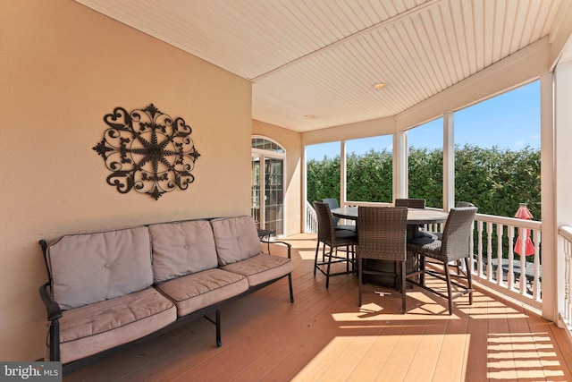 sunroom with wooden ceiling