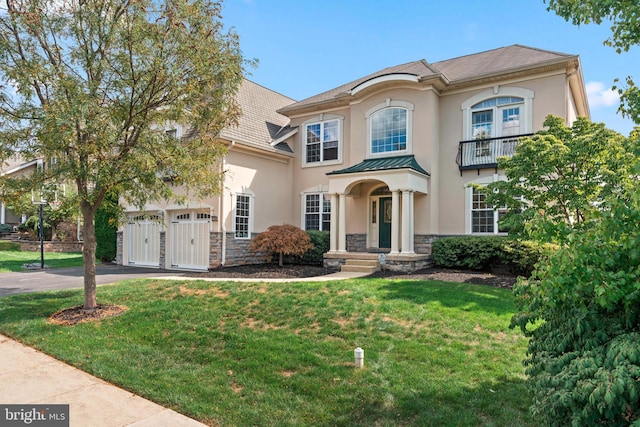 view of front of house featuring a garage and a front lawn