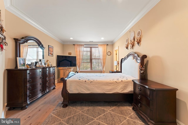 bedroom featuring recessed lighting, ornamental molding, baseboards, and wood finished floors