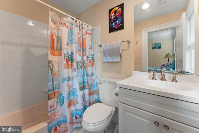 ensuite bathroom featuring ensuite bathroom, shower / tub combo, toilet, and vanity
