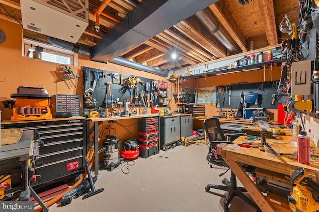 basement with a workshop area