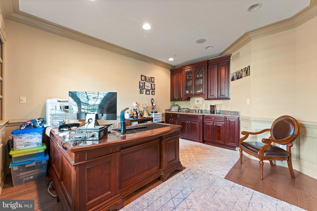 office with ornamental molding and light wood-type flooring