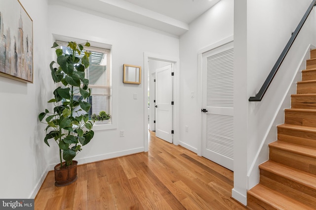 foyer entrance with light hardwood / wood-style flooring