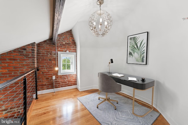 office with lofted ceiling with beams, wood-type flooring, and brick wall