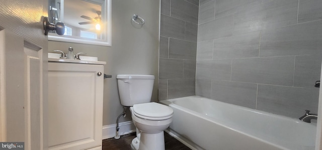 full bathroom with toilet, ceiling fan, tiled shower / bath, vanity, and hardwood / wood-style flooring