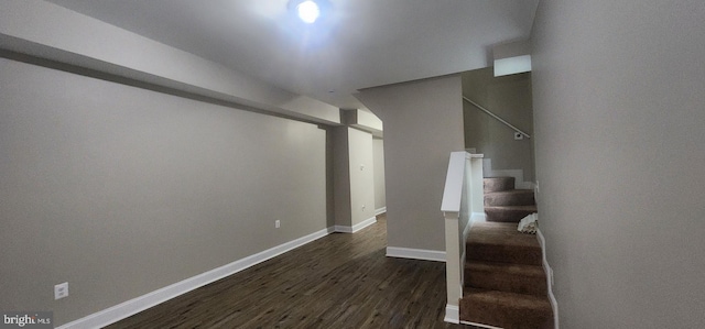 stairs featuring hardwood / wood-style floors