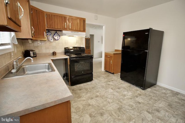 kitchen with decorative backsplash, black appliances, sink, and extractor fan