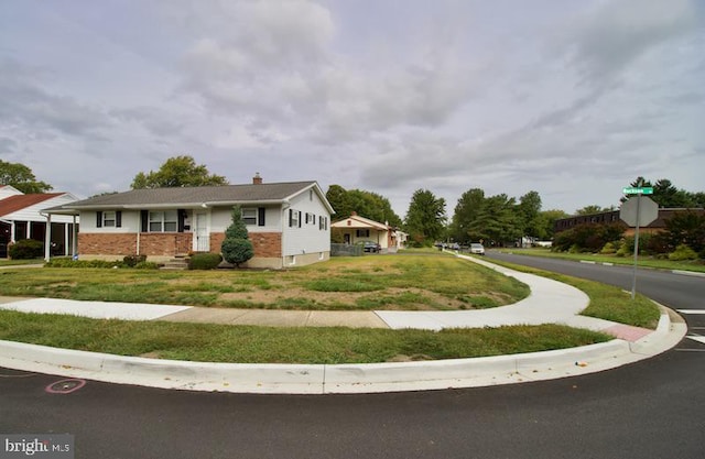 view of front of home with a front yard