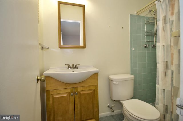 bathroom featuring walk in shower, vanity, and toilet