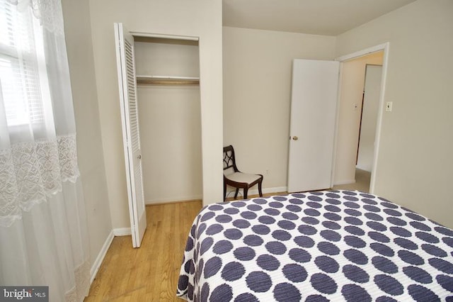 bedroom with a closet and light wood-type flooring