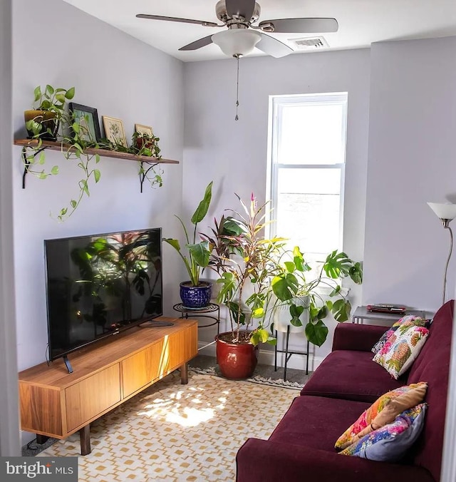 living room featuring ceiling fan