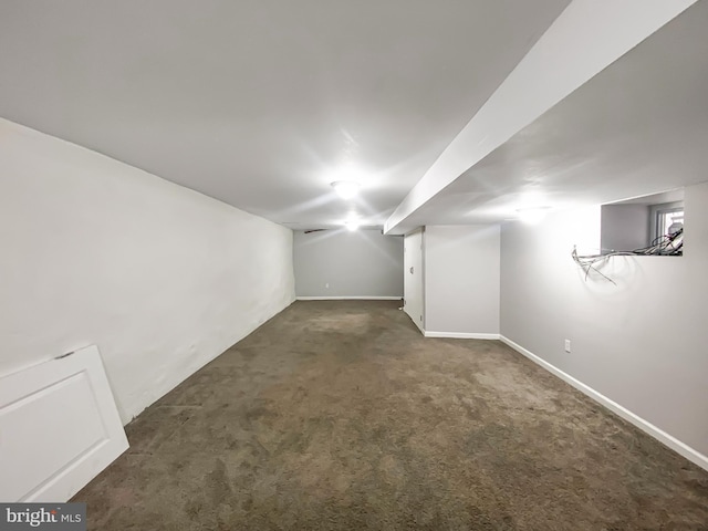 basement with dark colored carpet