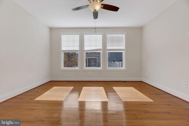 empty room featuring light hardwood / wood-style flooring and ceiling fan