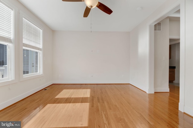 empty room featuring ceiling fan and wood-type flooring