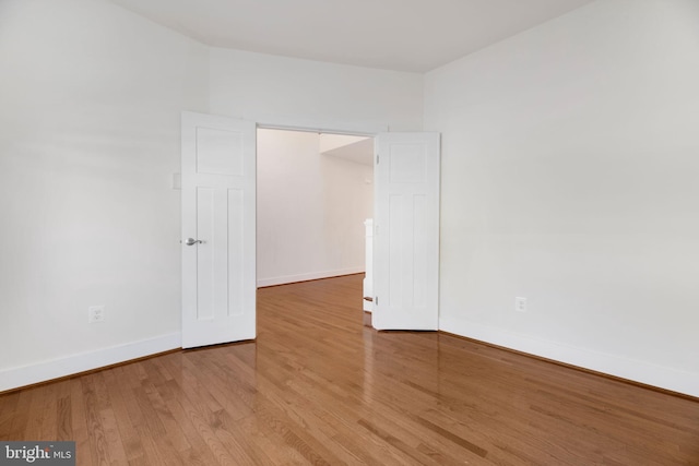 unfurnished room featuring hardwood / wood-style floors