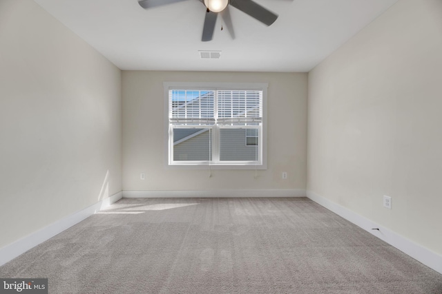 unfurnished room with light carpet and ceiling fan