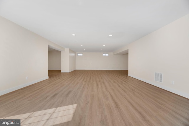 empty room with light hardwood / wood-style floors