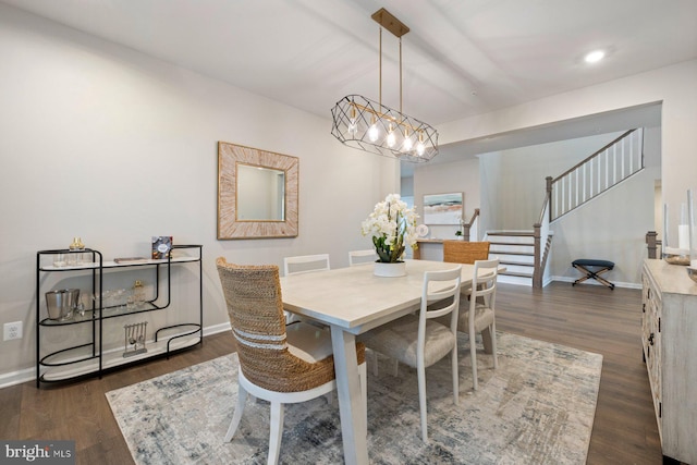 dining room featuring a chandelier and dark hardwood / wood-style flooring