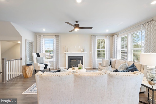 living room with hardwood / wood-style flooring and ceiling fan