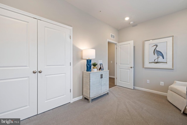 sitting room with light colored carpet