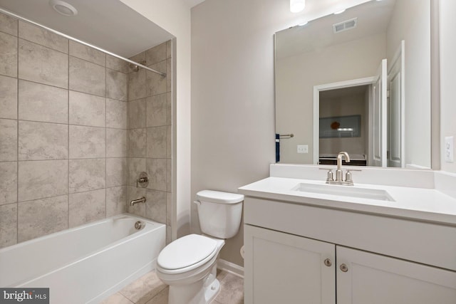 full bathroom with vanity, tiled shower / bath combo, toilet, and tile patterned flooring