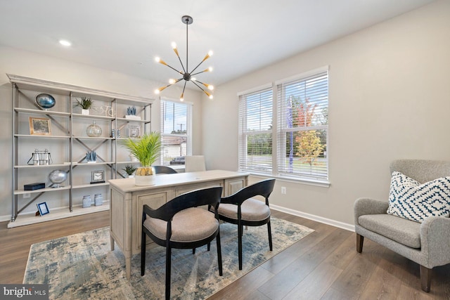 office space featuring dark hardwood / wood-style floors and a notable chandelier