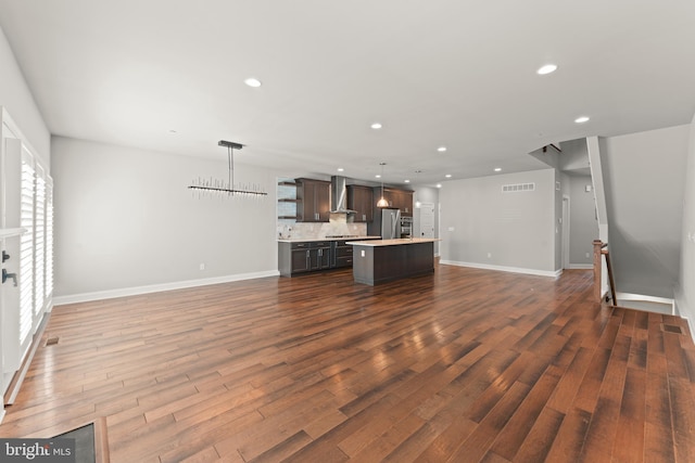 unfurnished living room featuring dark wood-type flooring